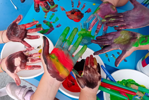 Collage of kids hands with paint