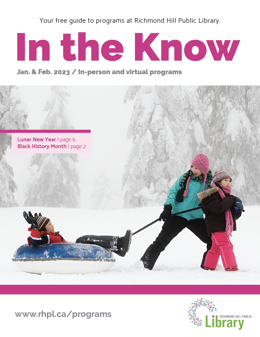 A cover of the program guide. With three kids in jackets and snowpants playing with a sled outside with snow.