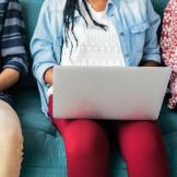 Image of teen using a laptop.