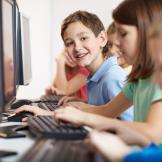 An image of kids on computer