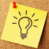 light bulb drawing on yellow note paper