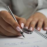 hand writing in a notebook
