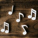 White music notes on a wooden table