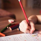 A child writing in a notebook
