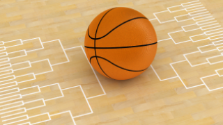 basketball with tournament bracket graphic